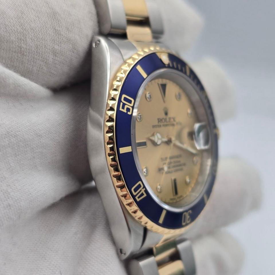 Submariner Date automatic luxury watch with champagne dial and two-tone bracelet