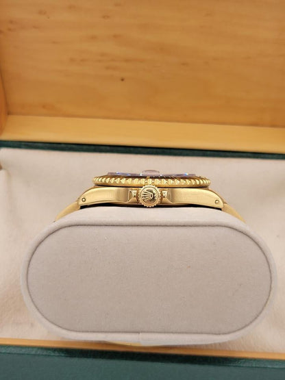 Submariner Date automatic luxury watch with black dial and yellow gold bracelet