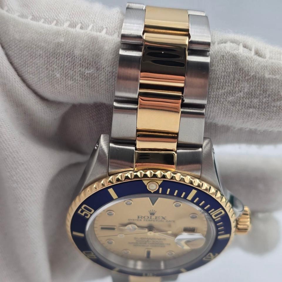 Submariner Date automatic luxury watch with champagne dial and two-tone bracelet