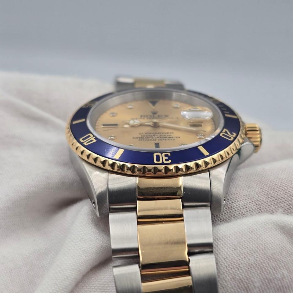 Submariner Date automatic luxury watch with champagne dial and two-tone bracelet