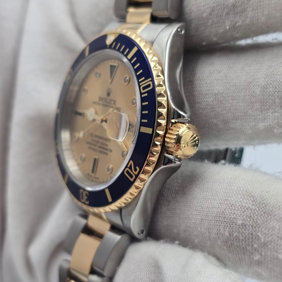 Submariner Date automatic luxury watch with champagne dial and two-tone bracelet